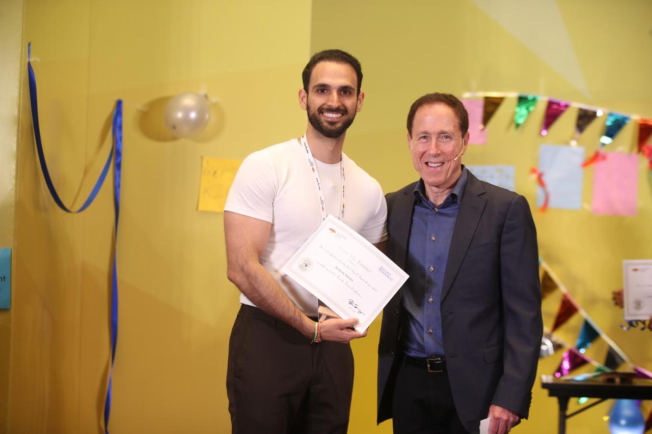 Rohan Batra receiving certificate